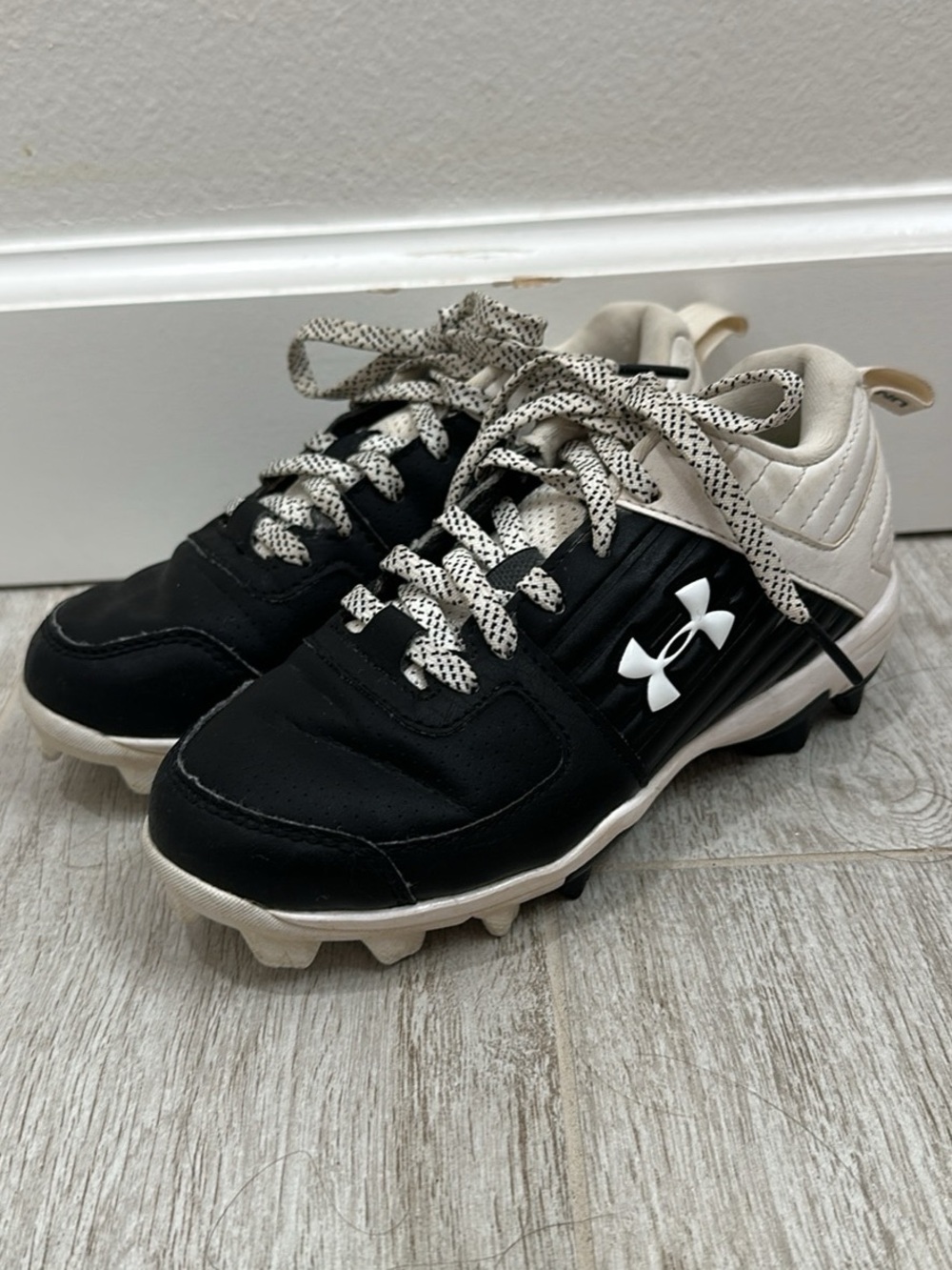 Under Armour Black and Cream Kids Cleats